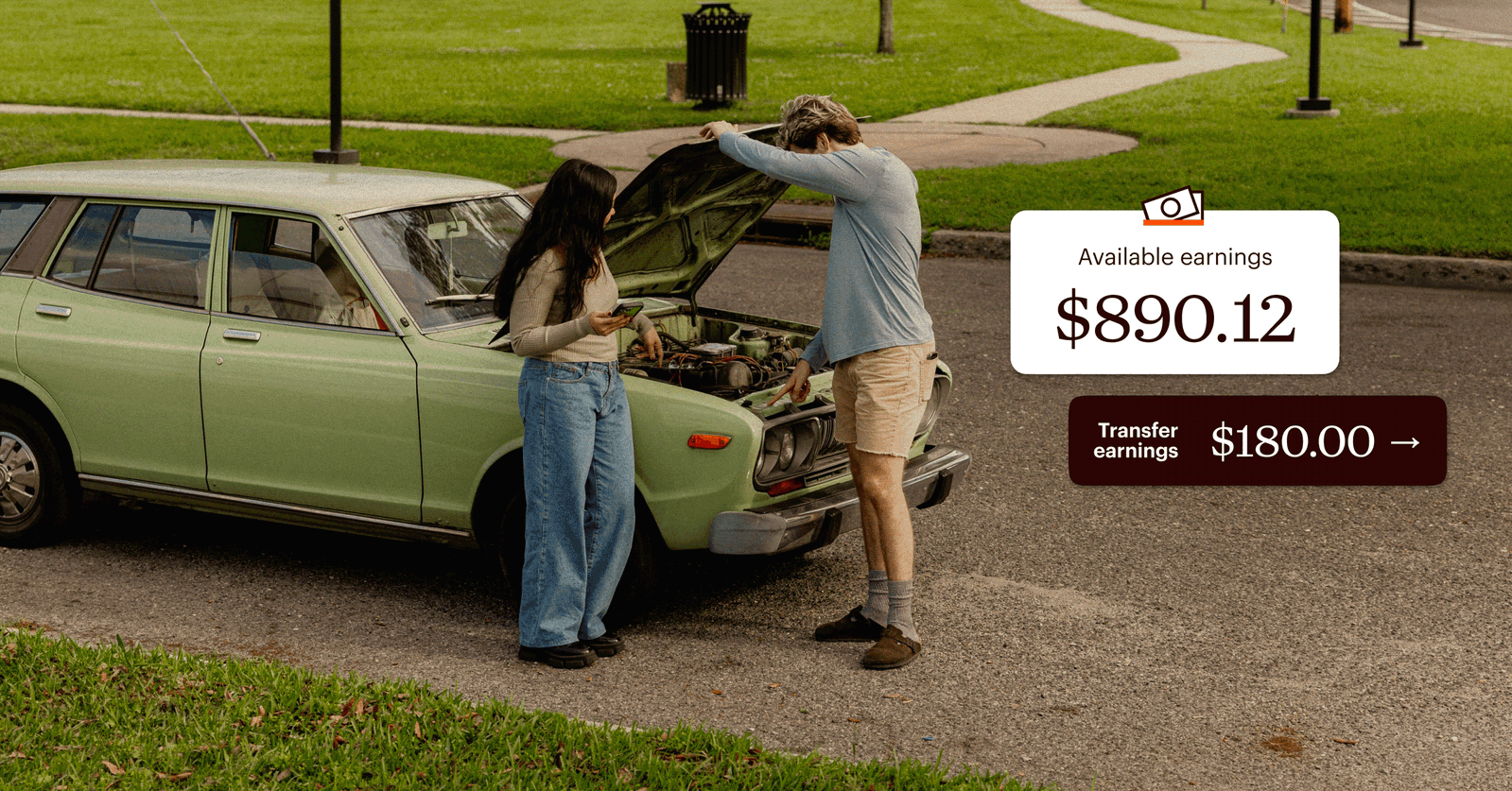 Two people stand by an open car hood in a park, with a digital overlay showing “Available earnings $890.12” and a “Transfer earnings $180.00” button.